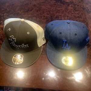2 Nwot New Era baseball caps 1 is NBA Los Angeles the 2nd one is L.A. MLB